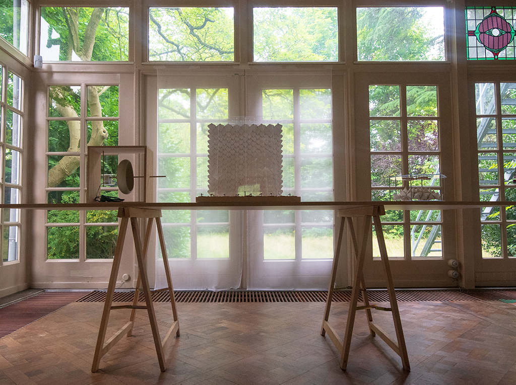A table displaying a maquette in front of a big windows