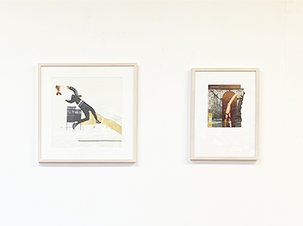 Art frames hanging on a white wall.
