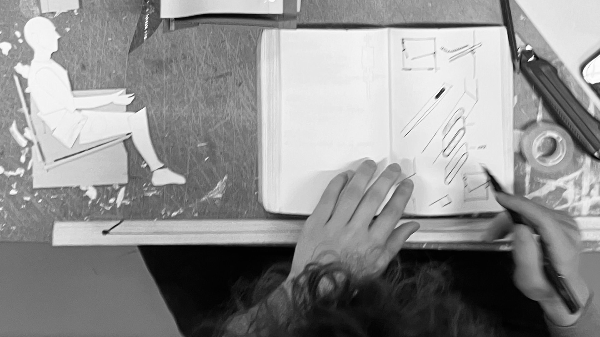 Top view of a sketch booklet while sketching.