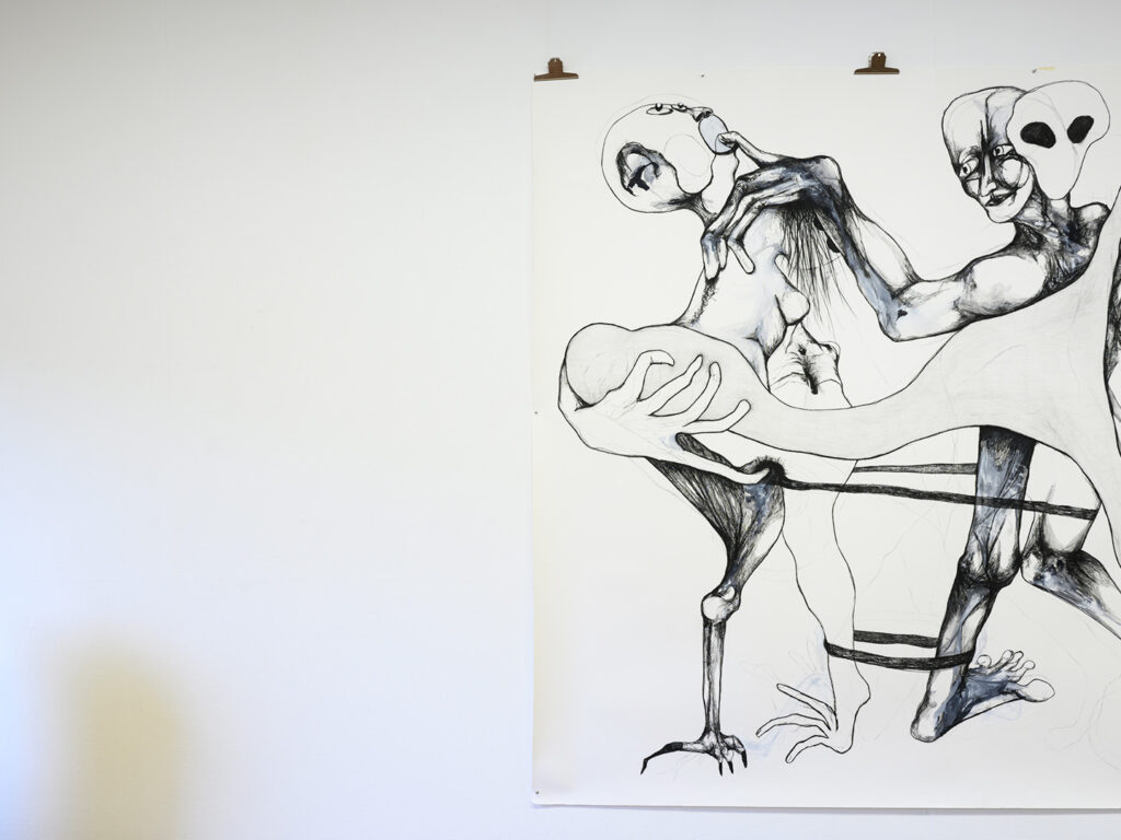 A big black and white illustration hanging from the wall.