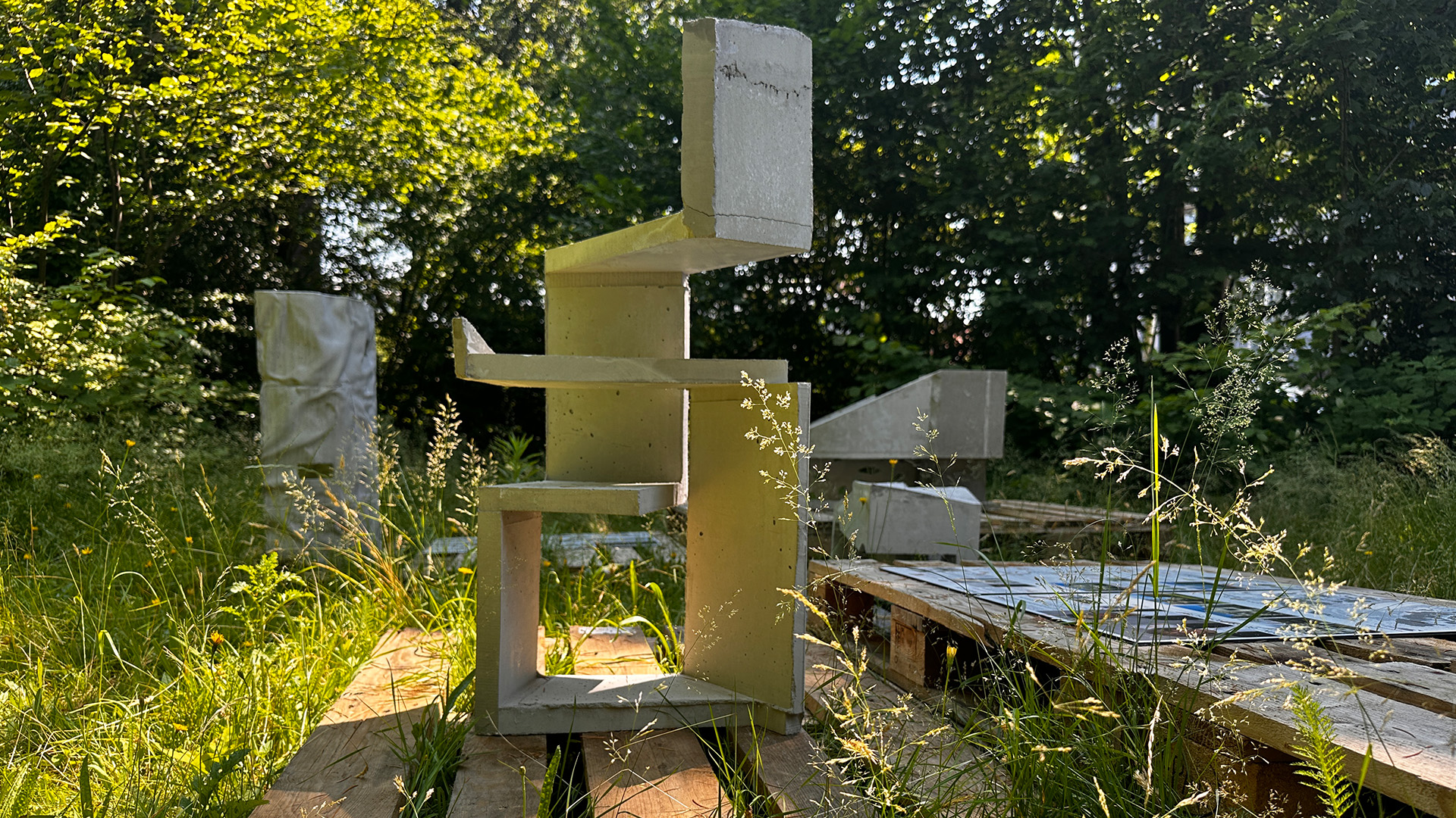Art piece made of concrete displayed in a green garden