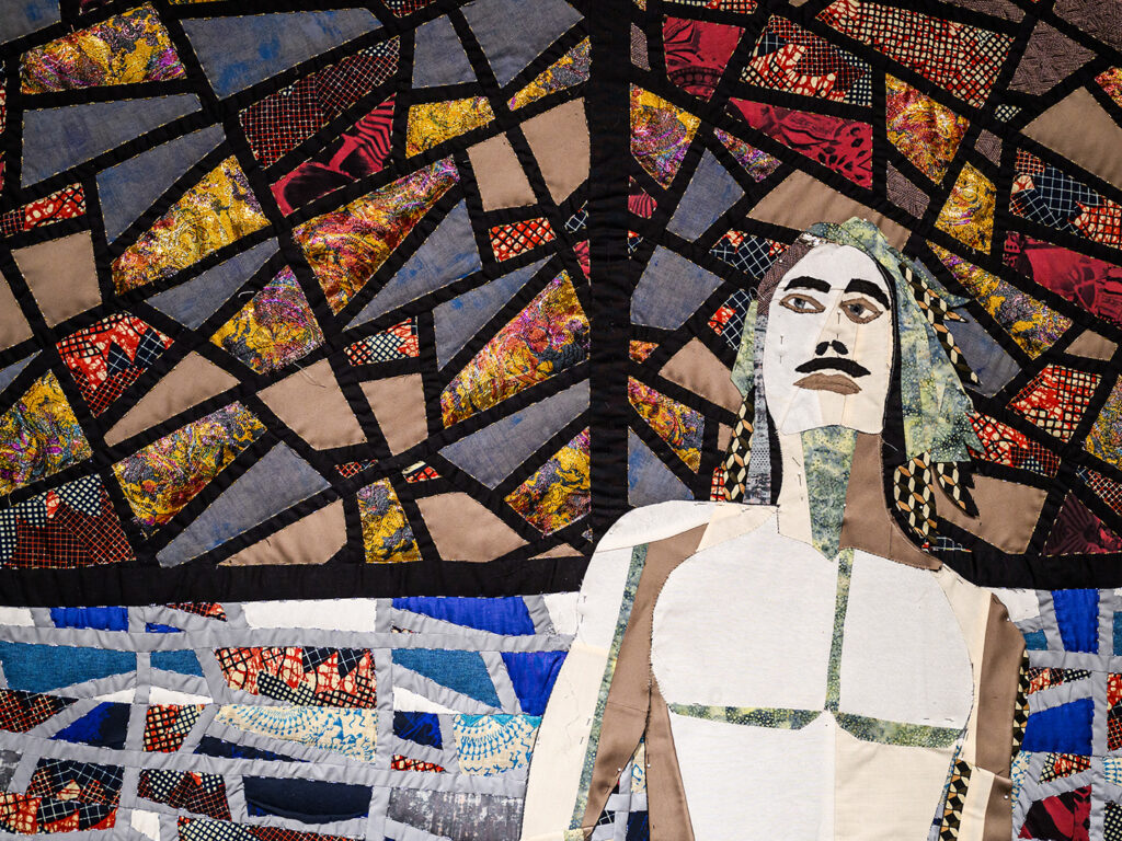 A textile composition photographed with a vitro-style background, showing a figure of a standing man.