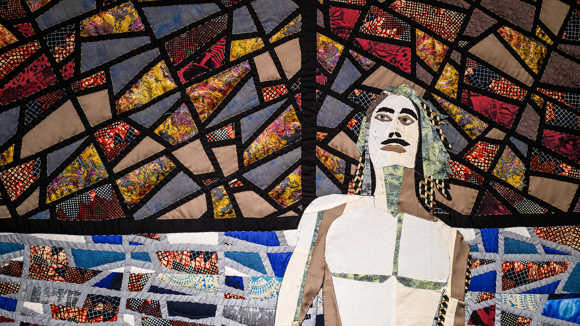 A textile composition photographed with a vitro-style background, showing a figure of a standing man.