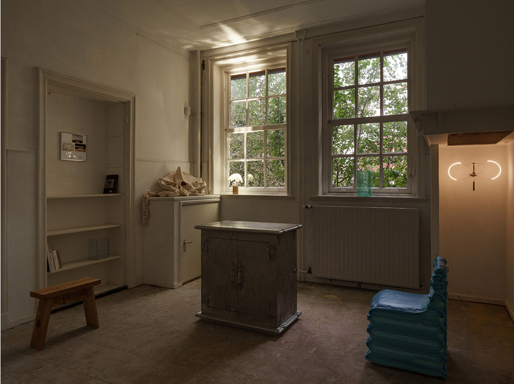 Overview of 2 designed pieces in a white room.