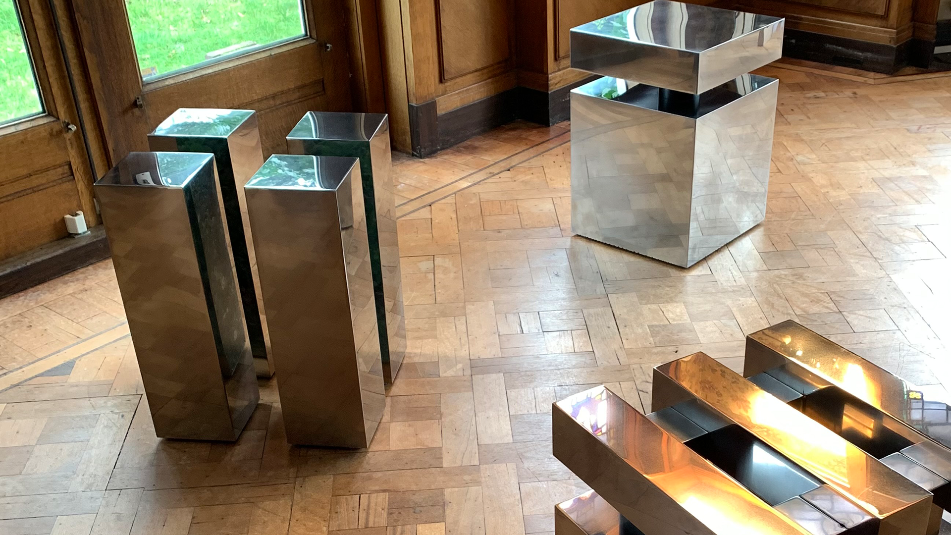 Metal block pieces scattered around a room.