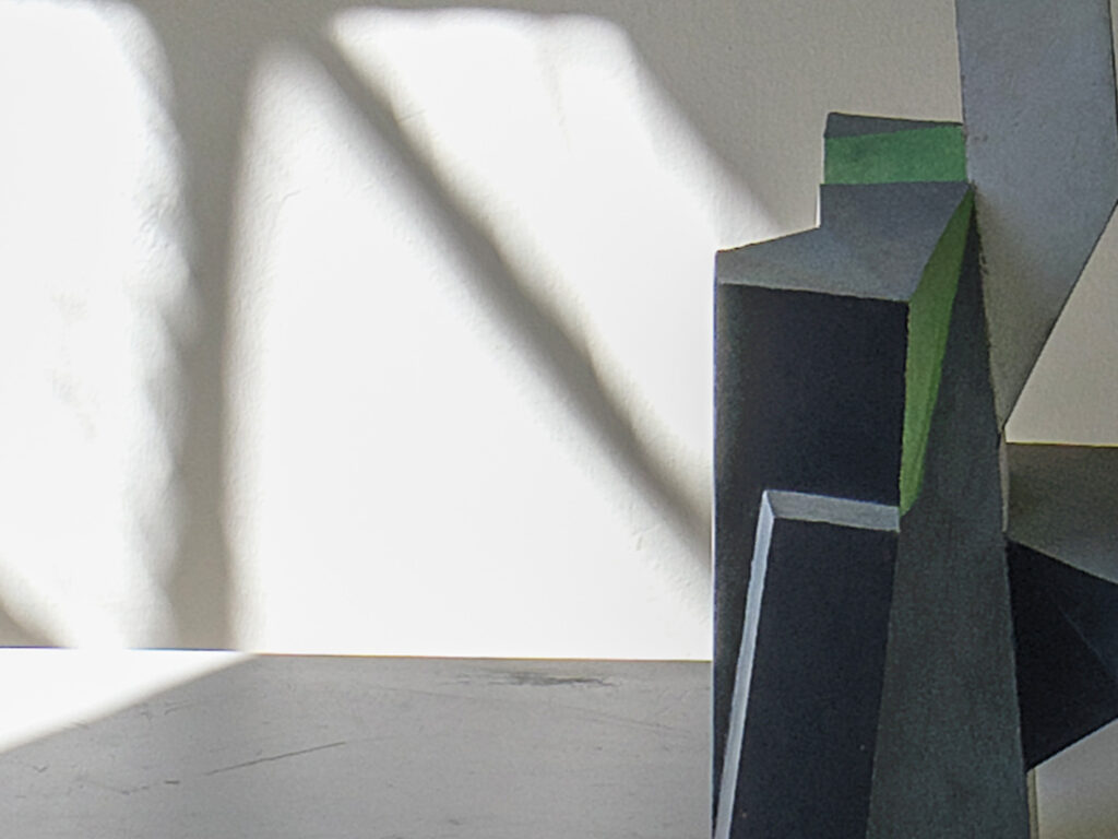 A detailed image from a sculpture on a white table.