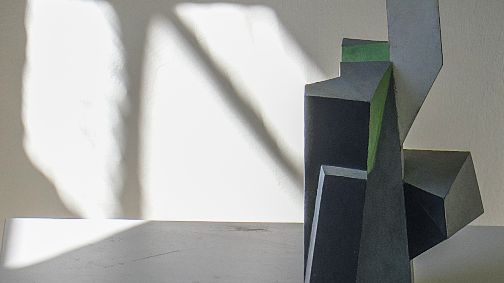 A detailed image from a sculpture on a white table.