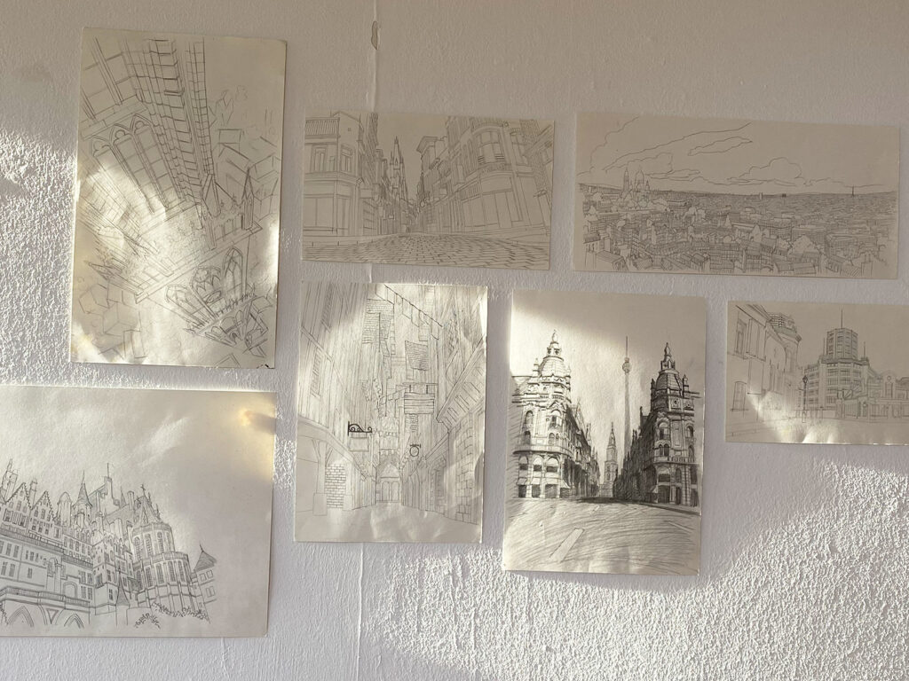 A white wall covered with delicate pencil sketches